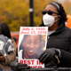 Jay Anderson Jr.’s mother, Linda Anderson, holds a sign on Oct. 29, 2020, during a rally in Chicago. Two special prosecutors have decided not to charge a Wisconsin sheriff’s deputy in the fatal shooting of a man sleeping in a park. The prosecutors announced Wednesday, June 1, 2022 that they didn’t find sufficient evidence to charge Waukesha County Sheriff’s Deputy Joseph Mensah in Jay Anderson Jr.’s death in 2016. Their finding echoes Milwaukee County District Attorney John Chisholm’s decision not to charge Mensah, who was then a Wauwatosa police officer.